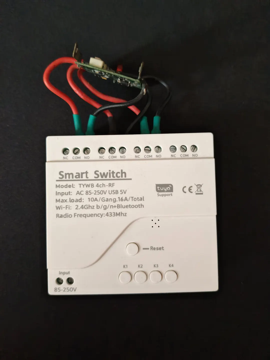 The Smart Switch Module with the garage door remote wired to it
